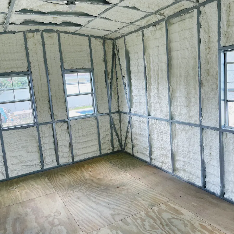 Closed-cell spray foam insulation applied to wall cavities in a residential project in Jamestown